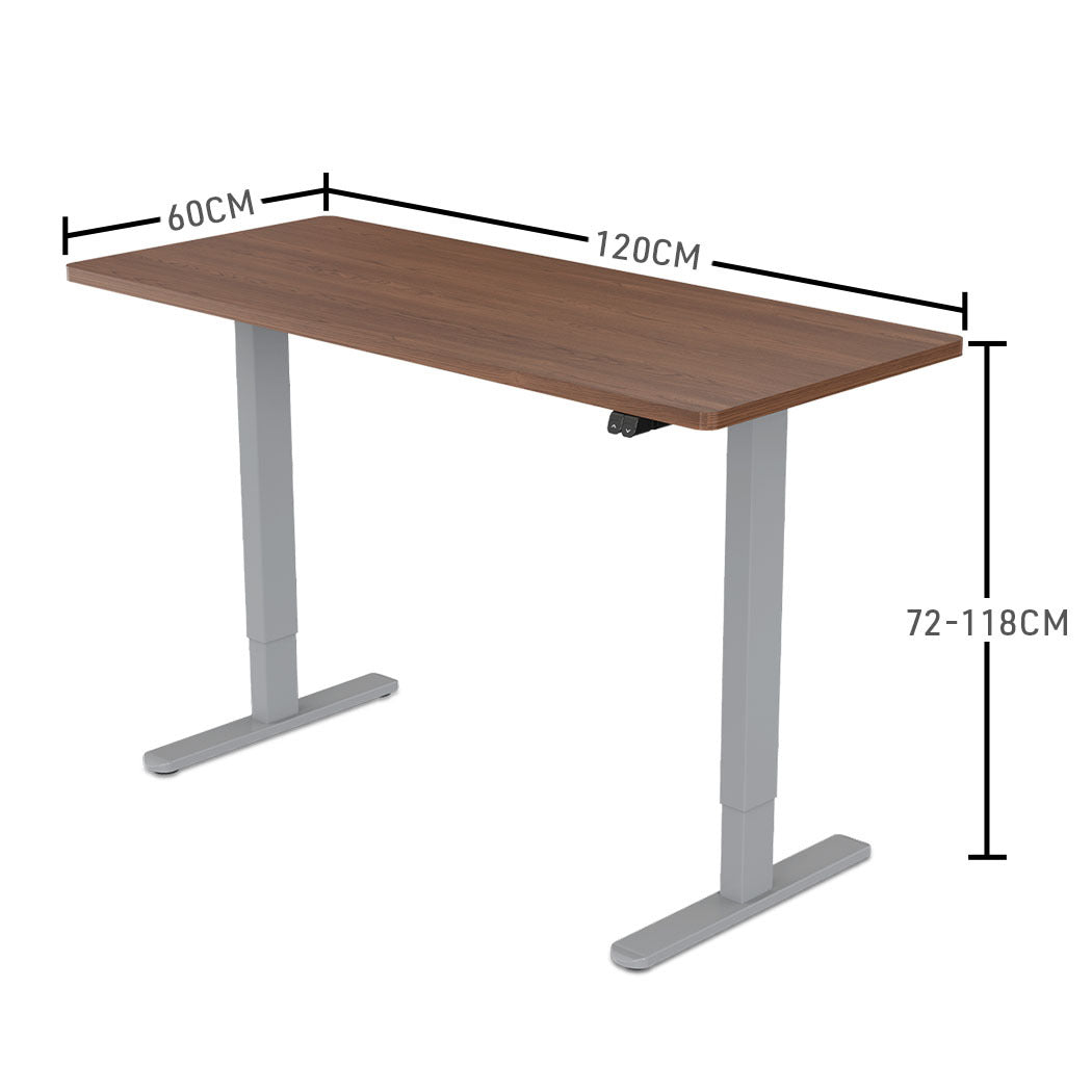 Fortia Sit To Stand Up Standing Desk, 120x60cm, 72-118cm Electric Height Adjustable, 70kg Load, Walnut Style/Silver Frame - Cosy Abode